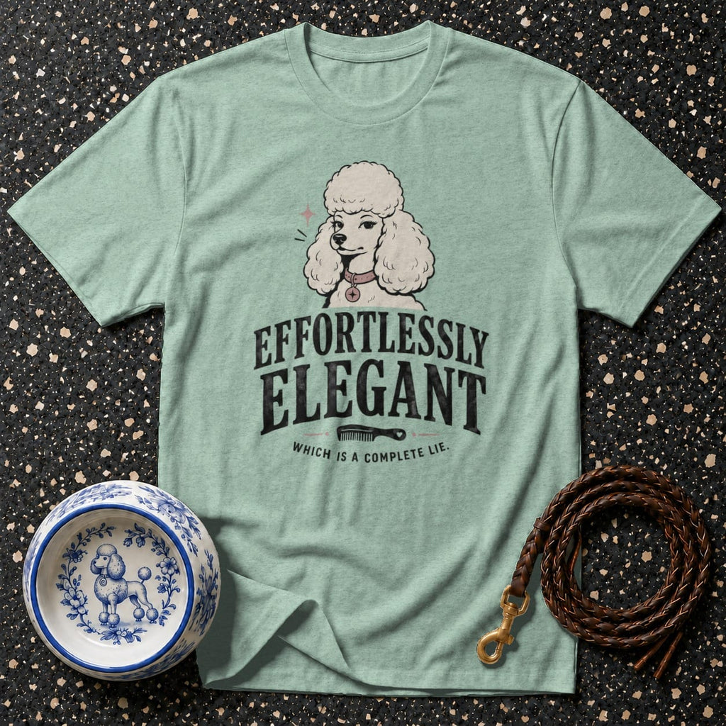 Light green t-shirt with poodle graphic and text "EFFORTLESSLY ELEGANT, WHICH IS A COMPLETE LIE."