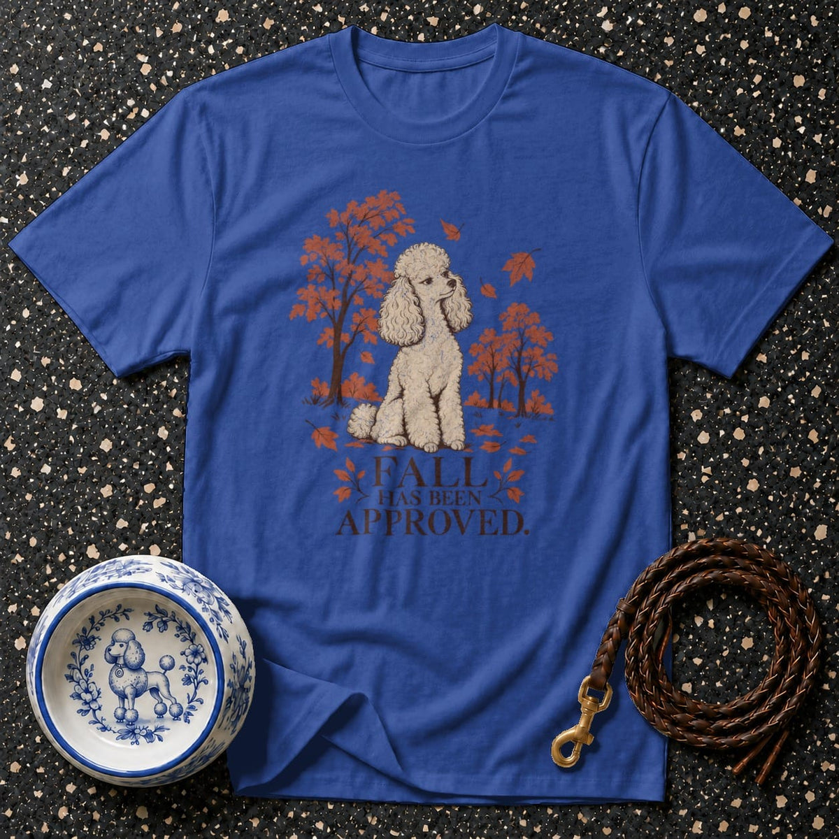 Royal blue t-shirt with a poodle illustration and the text "FALL HAS BEEN APPROVED."
