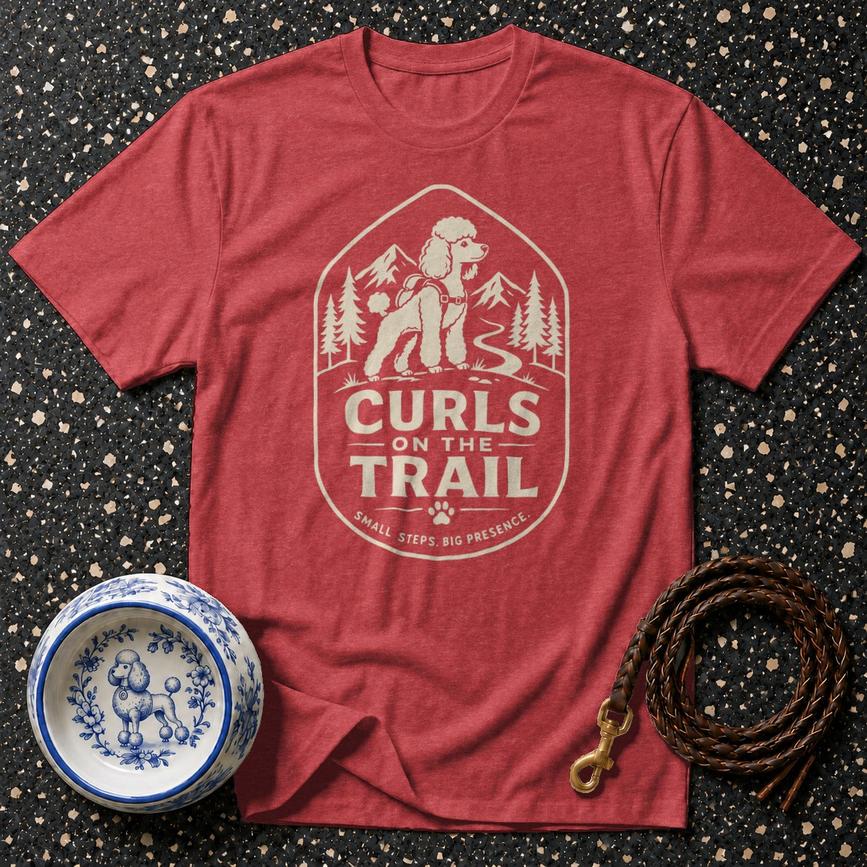 Red t-shirt with "Curls on the Trail" design featuring a poodle and mountains.