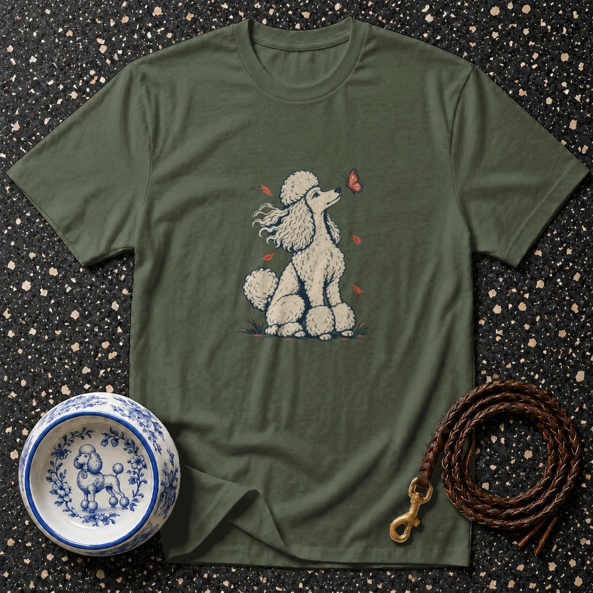Green t-shirt with a cream poodle illustration and a butterfly.