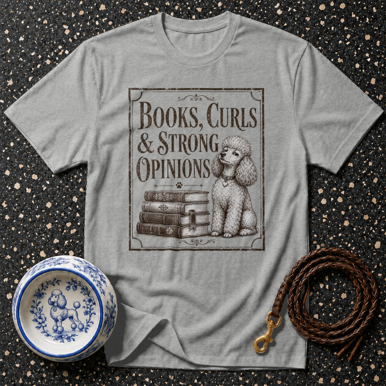 Grey t-shirt with "Books, Curls & Strong Opinions" and a poodle illustration.