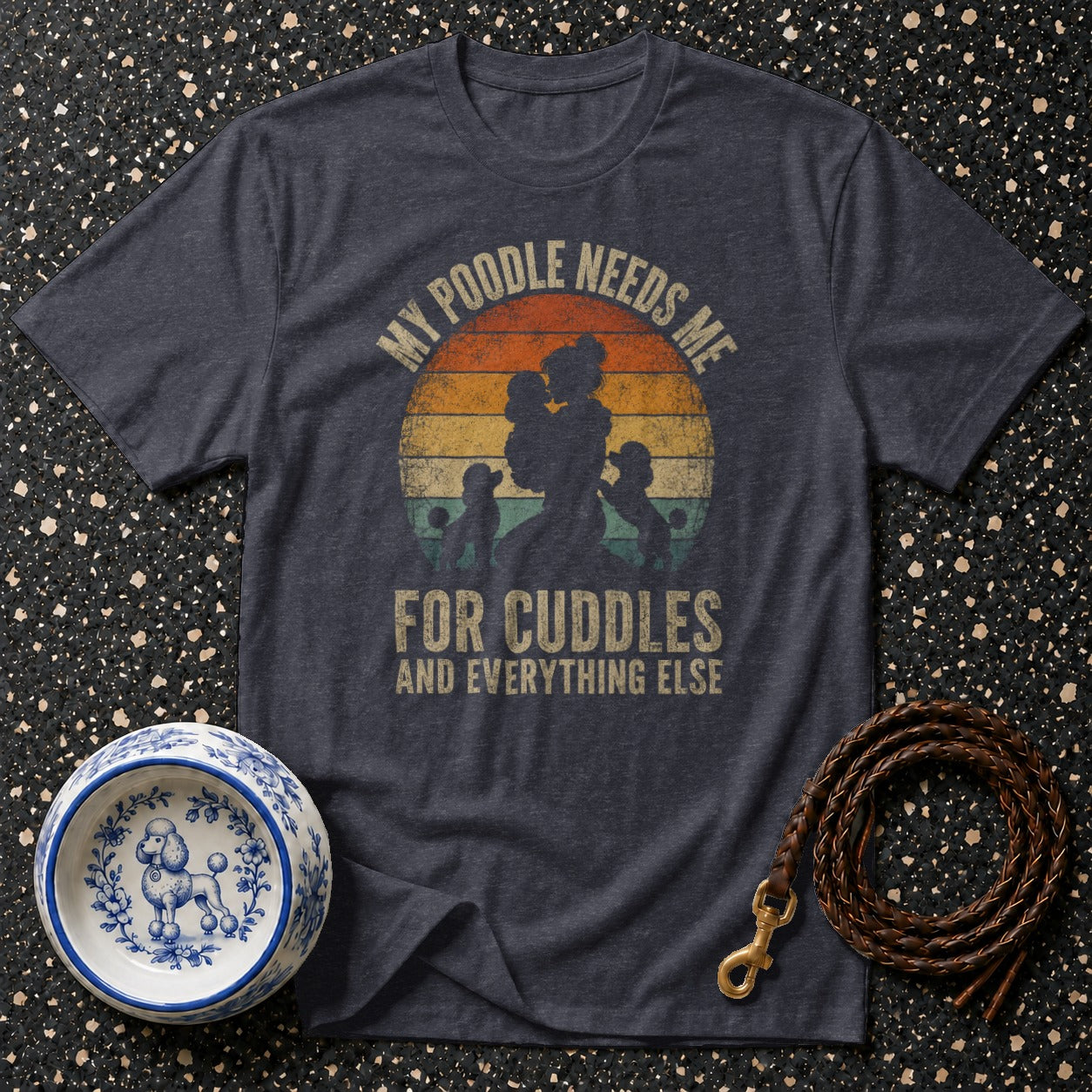 Dark t-shirt with poodle silhouette graphic and text "My Poodle Needs Me For Cuddles And Everything Else".