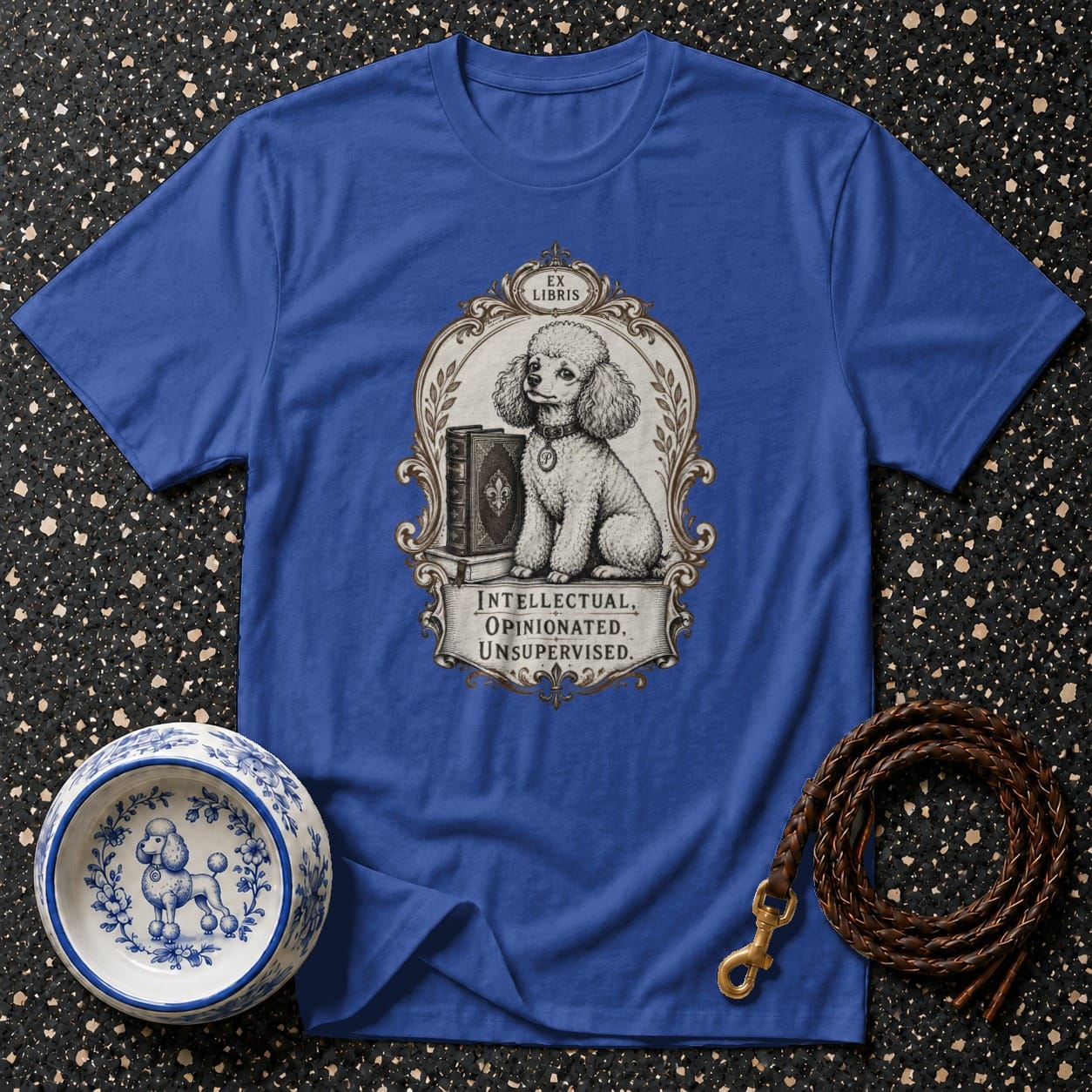 Blue t-shirt with illustration of a poodle sitting by books, text "EX LIBRIS" and "INTELLECTUAL, OPINIONATED, UNSUPERVISED."