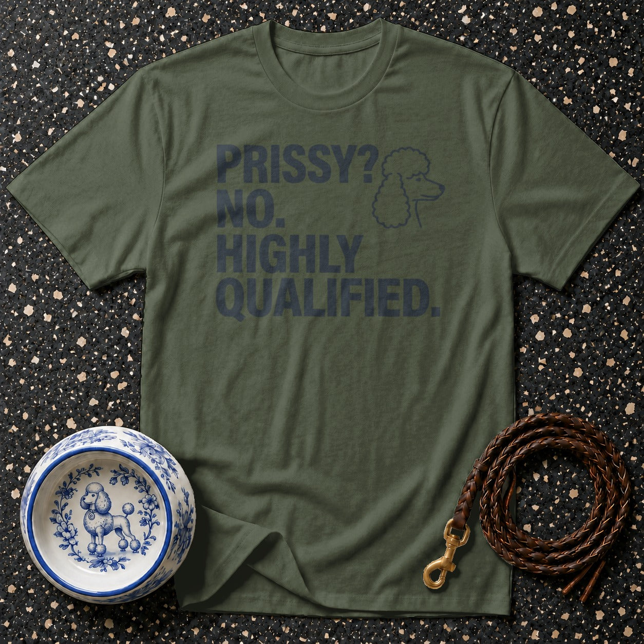 Green t-shirt with "PRISSY? NO. HIGHLY QUALIFIED." text and poodle graphic.
