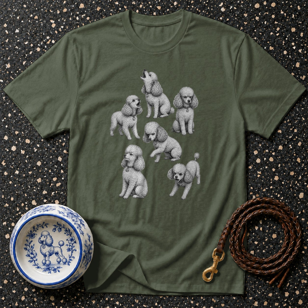 Green t-shirt with a drawing of seven poodles and a blue and white poodle-decorated bowl.