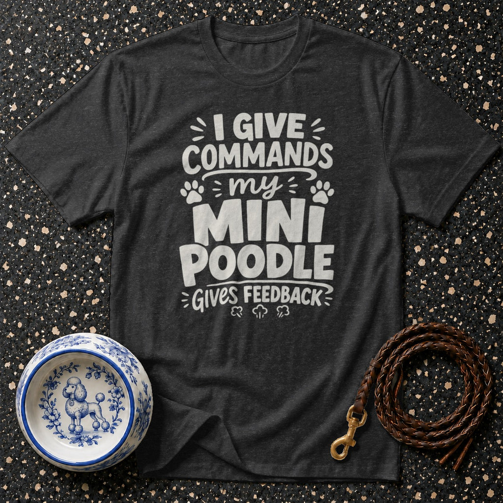 Dark grey t-shirt with white text "I GIVE COMMANDS my MINI POODLE GIVES FEEDBACK".