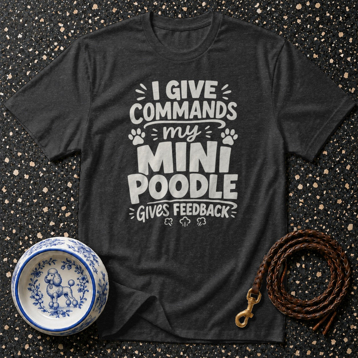 Dark grey t-shirt with white text "I GIVE COMMANDS my MINI POODLE GIVES FEEDBACK".