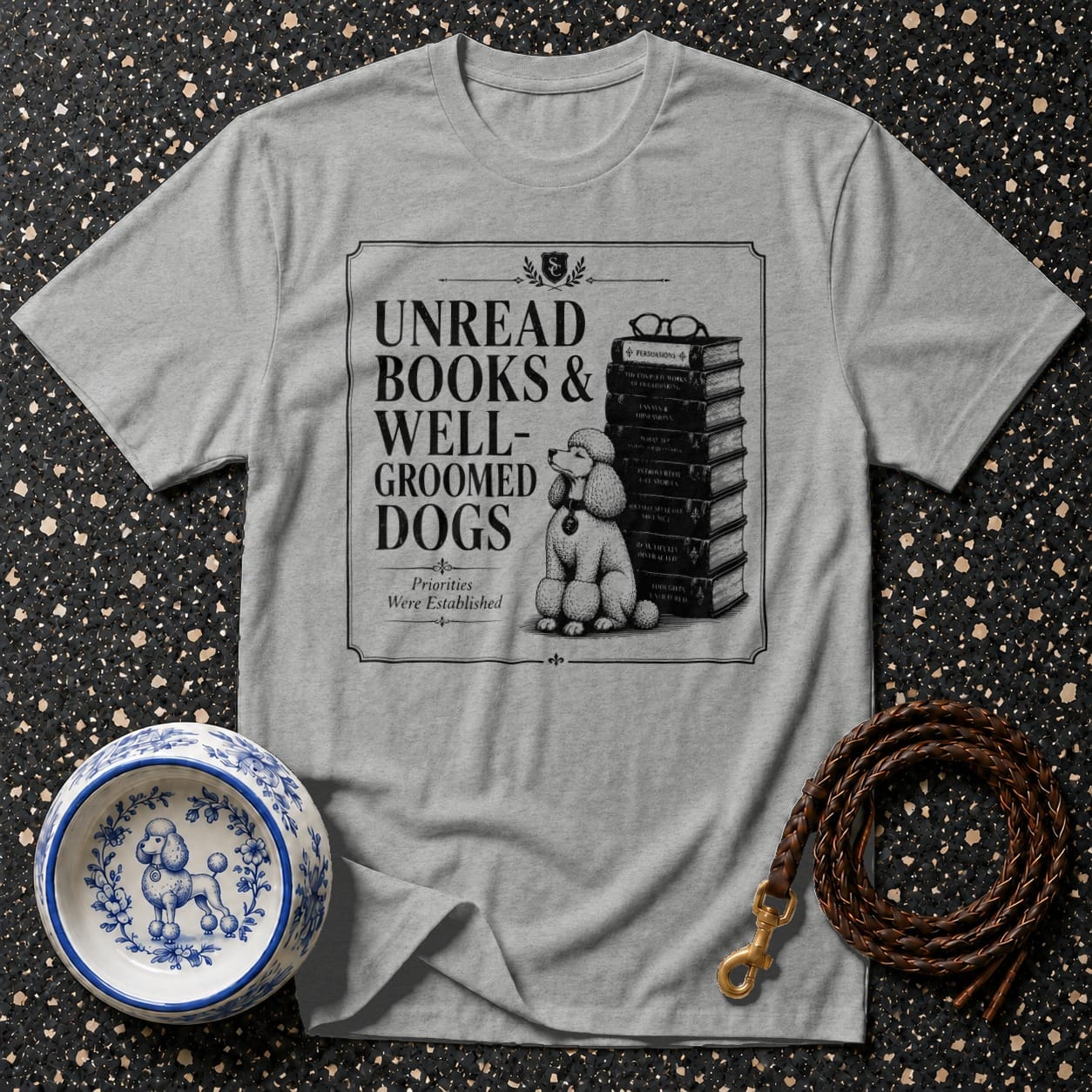 Grey t-shirt with "Unread Books & Well-Groomed Dogs" and poodle illustration.