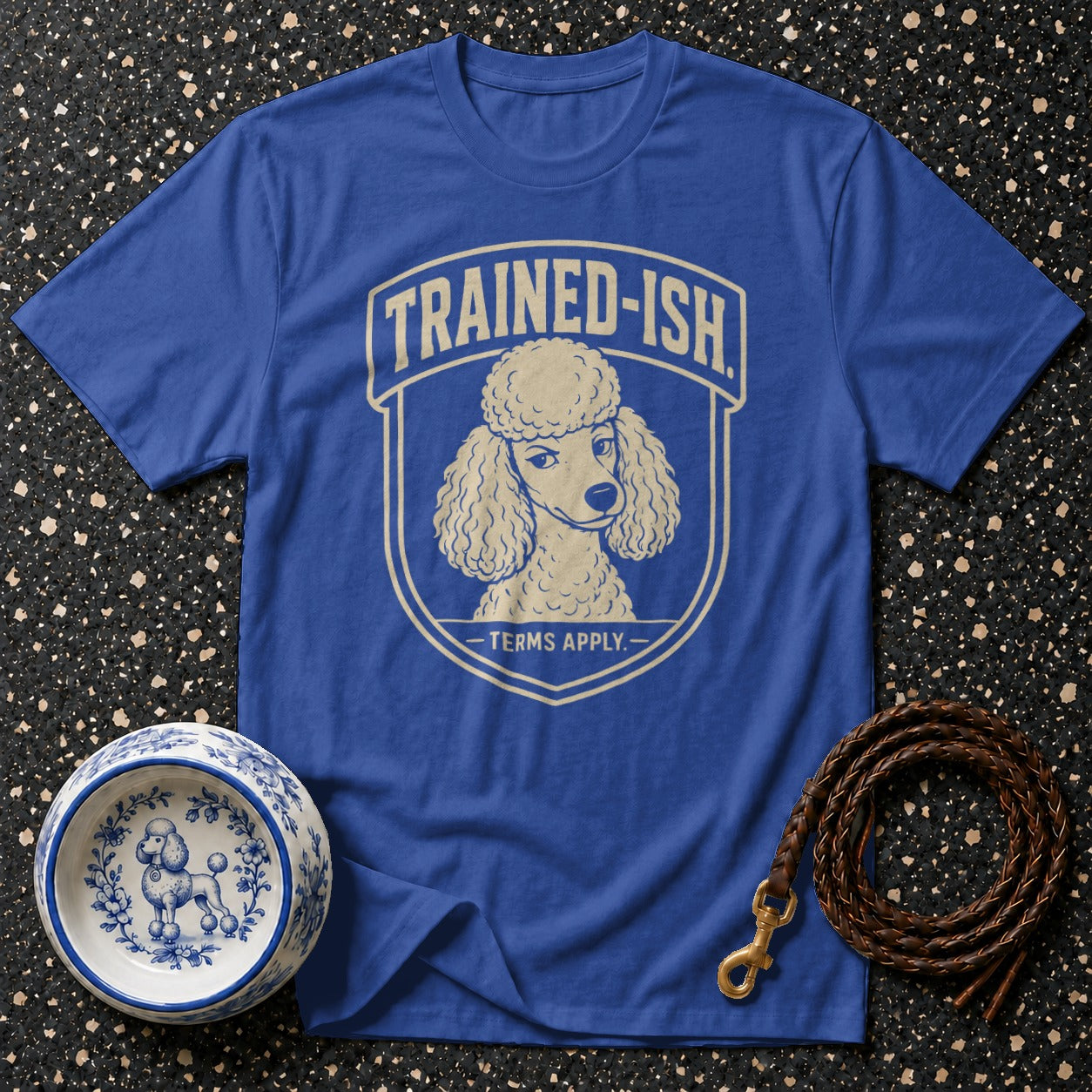 Blue t-shirt with "TRAINED-ISH TERMS APPLY" and a poodle graphic.