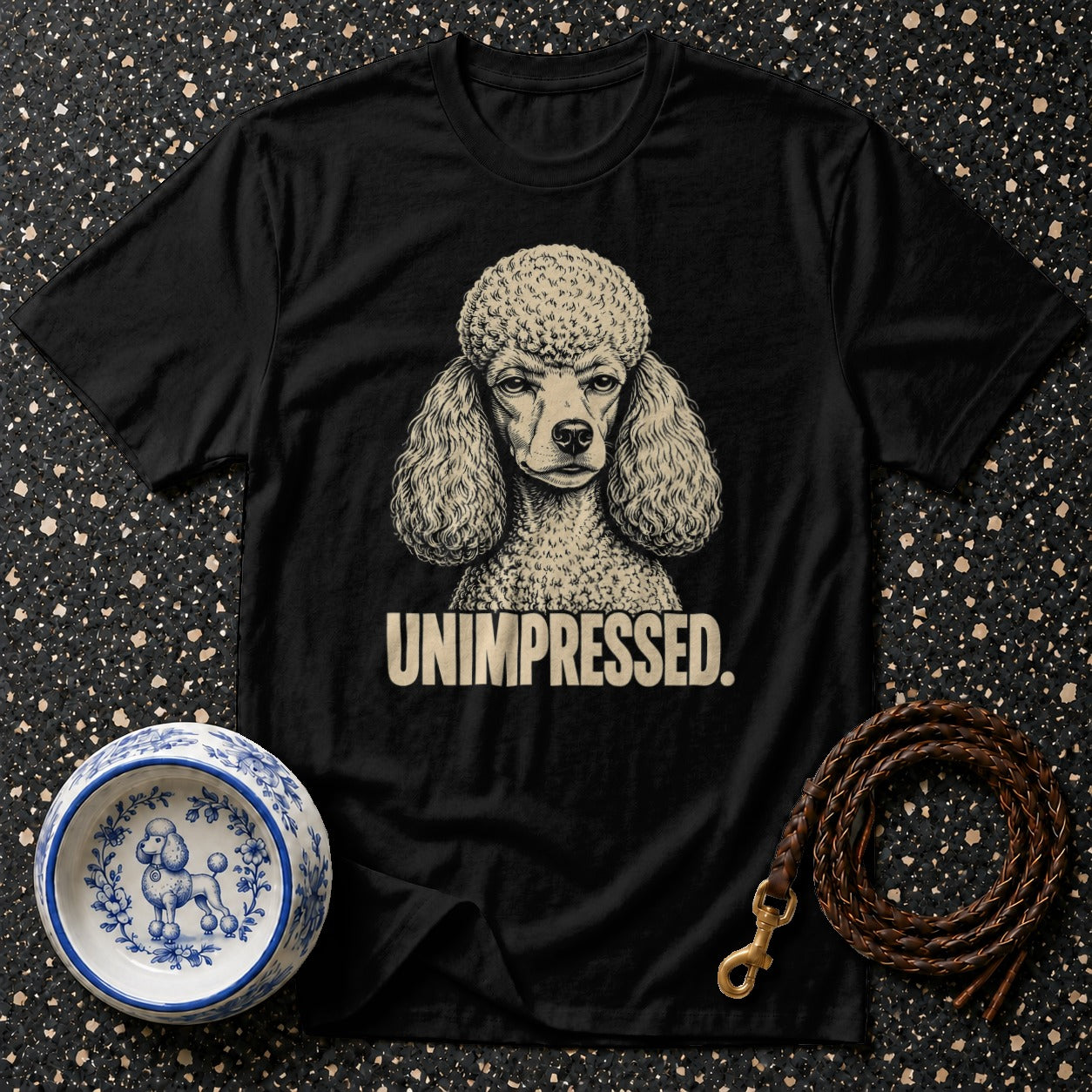 Black t-shirt with a vintage poodle graphic and "UNIMPRESSED." text.