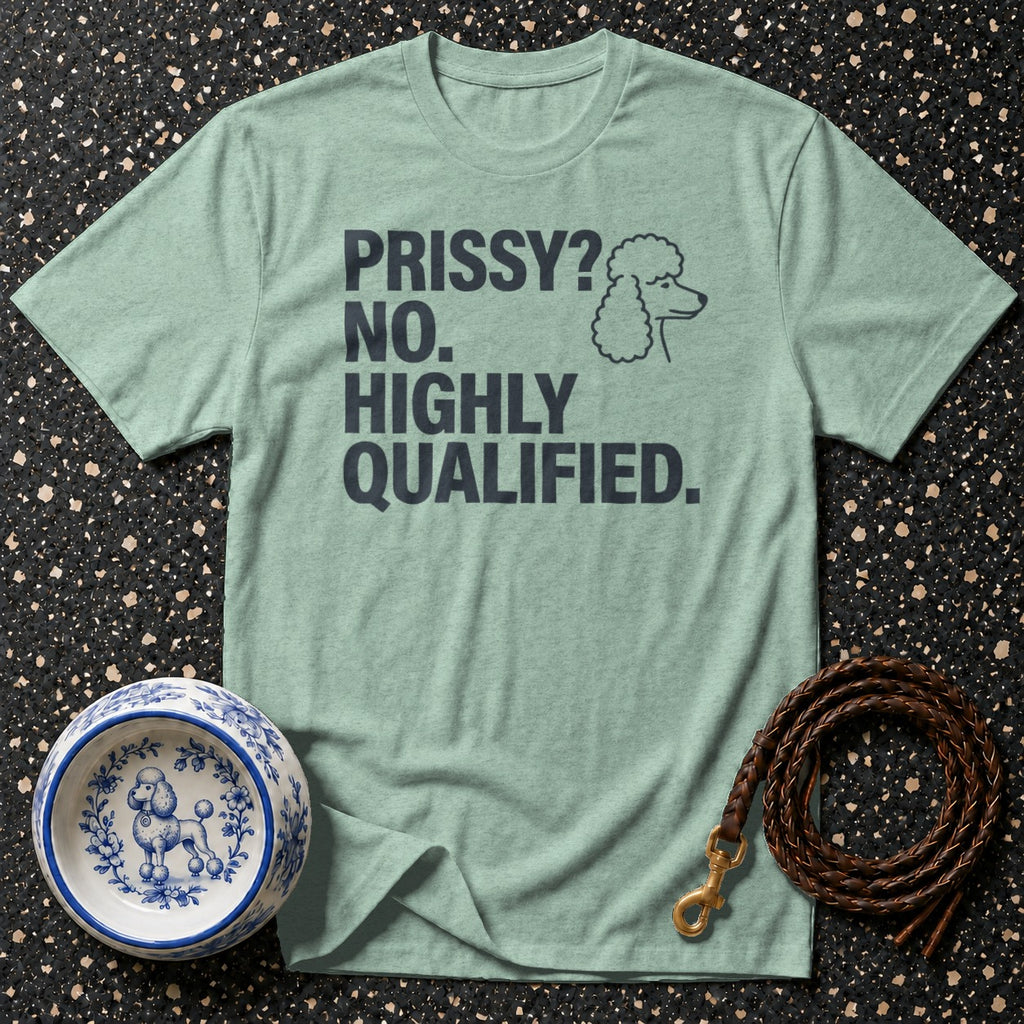 Green t-shirt with "PRISSY? NO. HIGHLY QUALIFIED." text and poodle graphic.