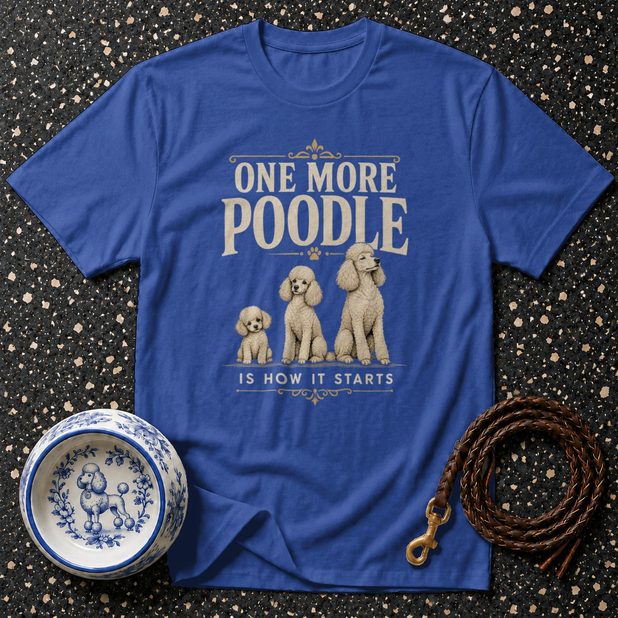 Blue t-shirt with "One More Poodle is How It Starts" and three poodles.