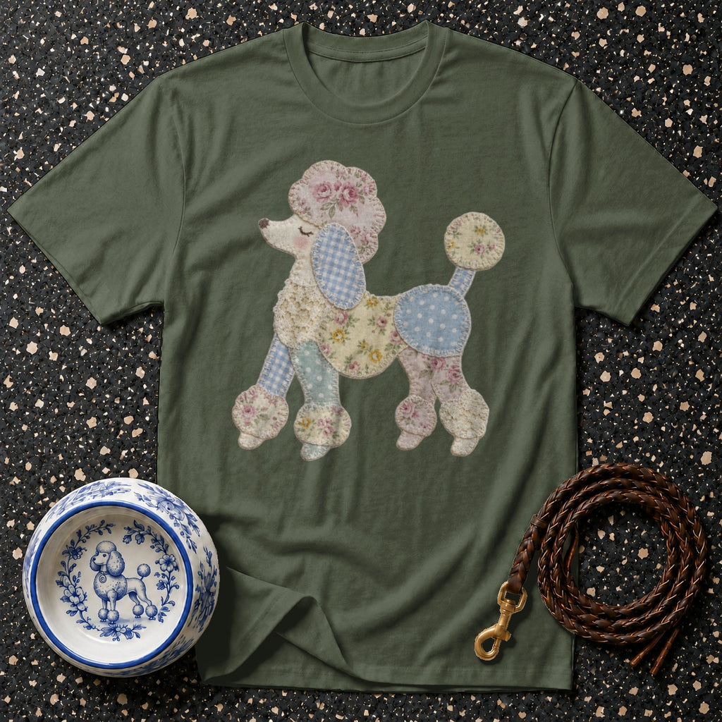 Green t-shirt with a patchwork poodle design, dog bowl, and leather leash.