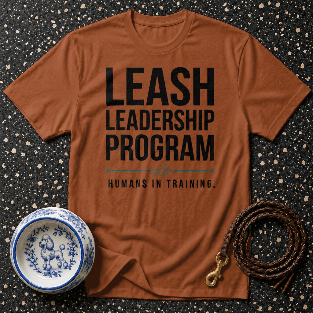 Brown t-shirt with text "LEASH LEADERSHIP PROGRAM HUMANS IN TRAINING."