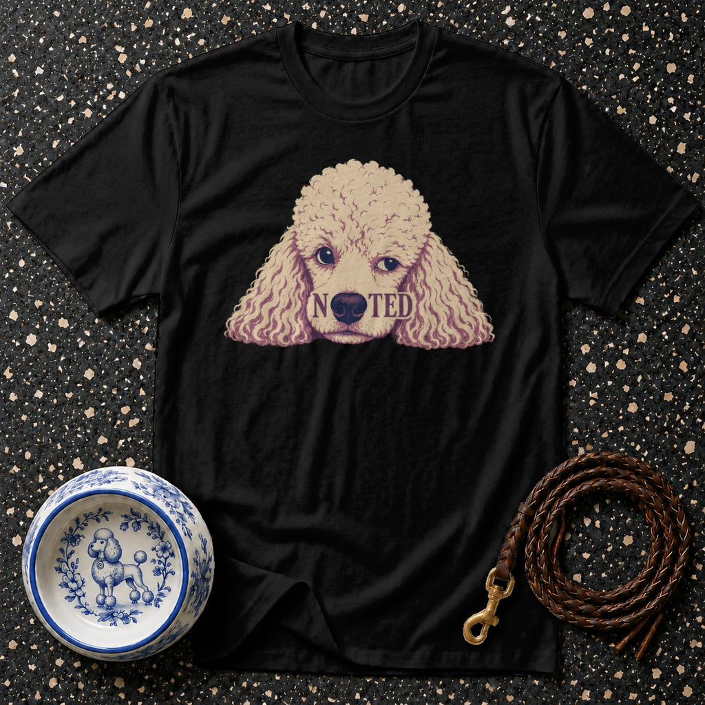 Black t-shirt with a poodle graphic and the word "NOTED".