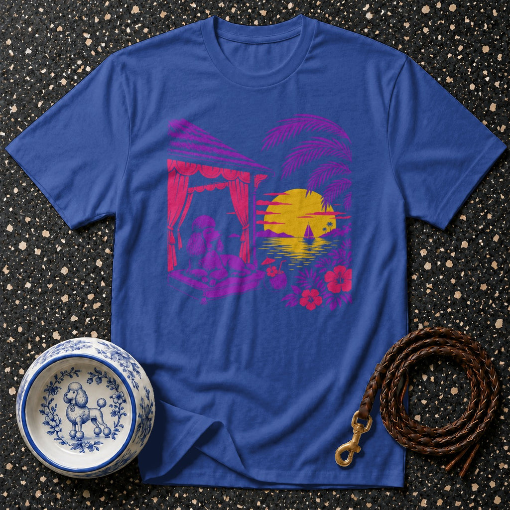 Blue t-shirt with a tropical sunset graphic featuring a dog in a cabana.