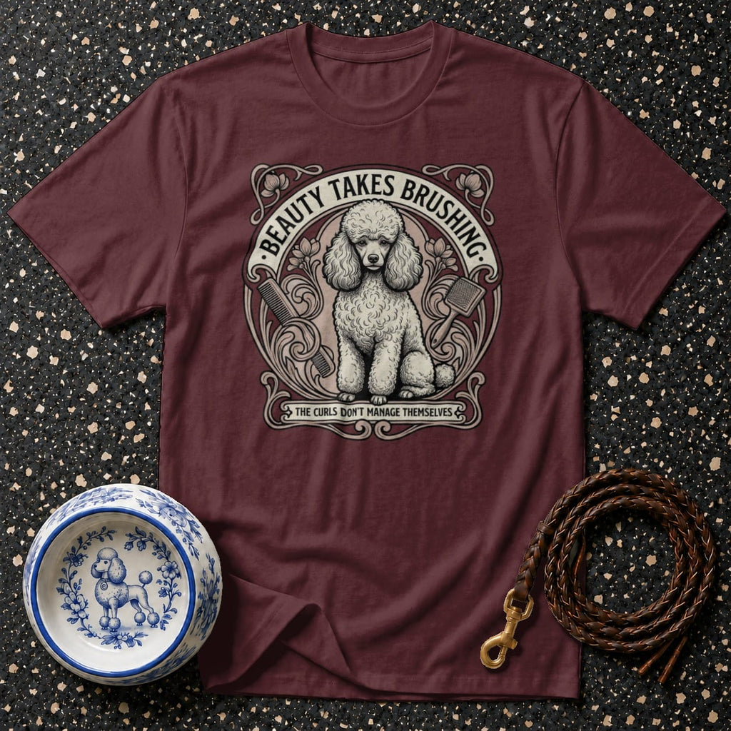 Burgundy t-shirt with poodle art and text: "Beauty Takes Brushing. The Curls Don't Manage Themselves."