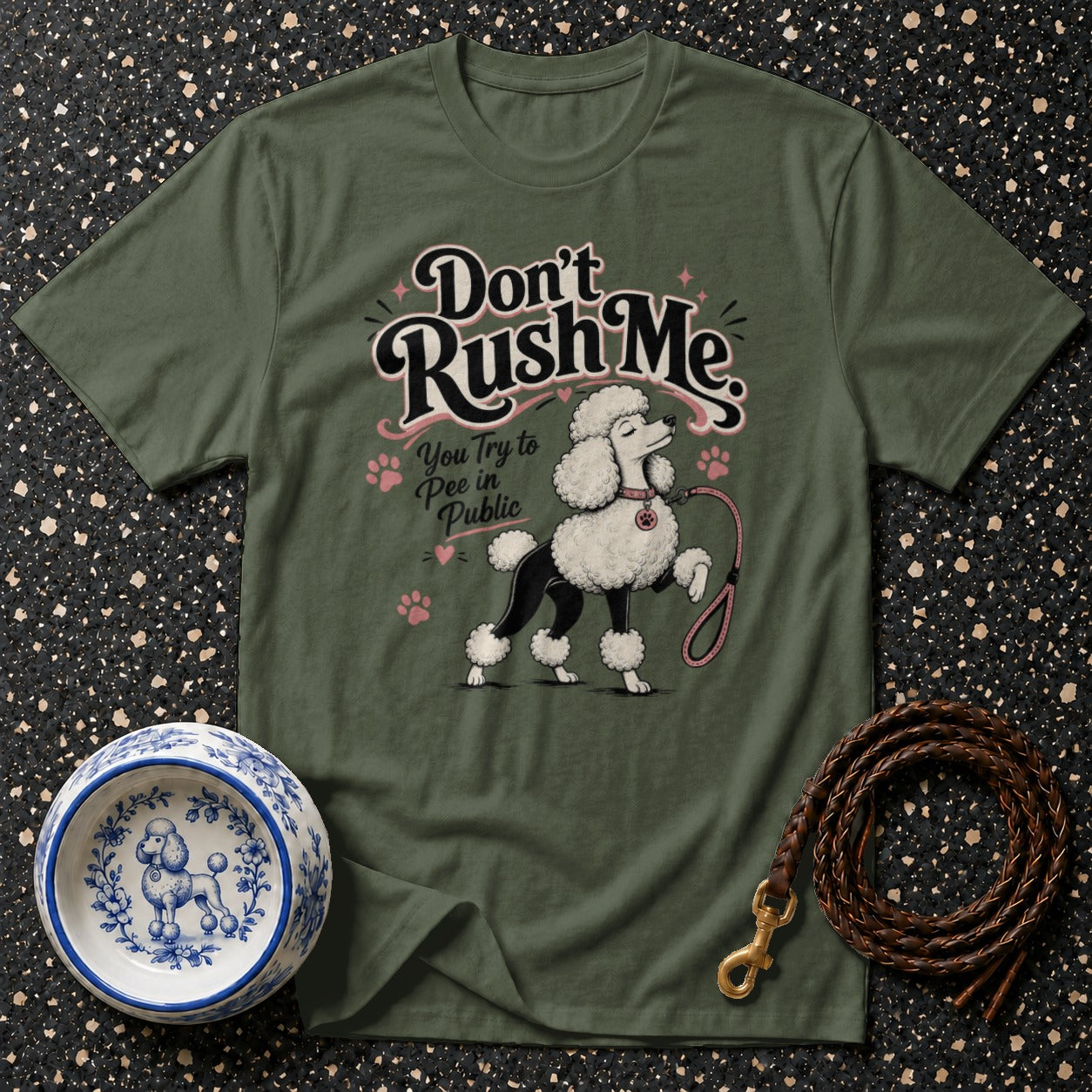 Green t-shirt featuring a poodle illustration with text "Don't Rush Me. You Try to Pee in Public."