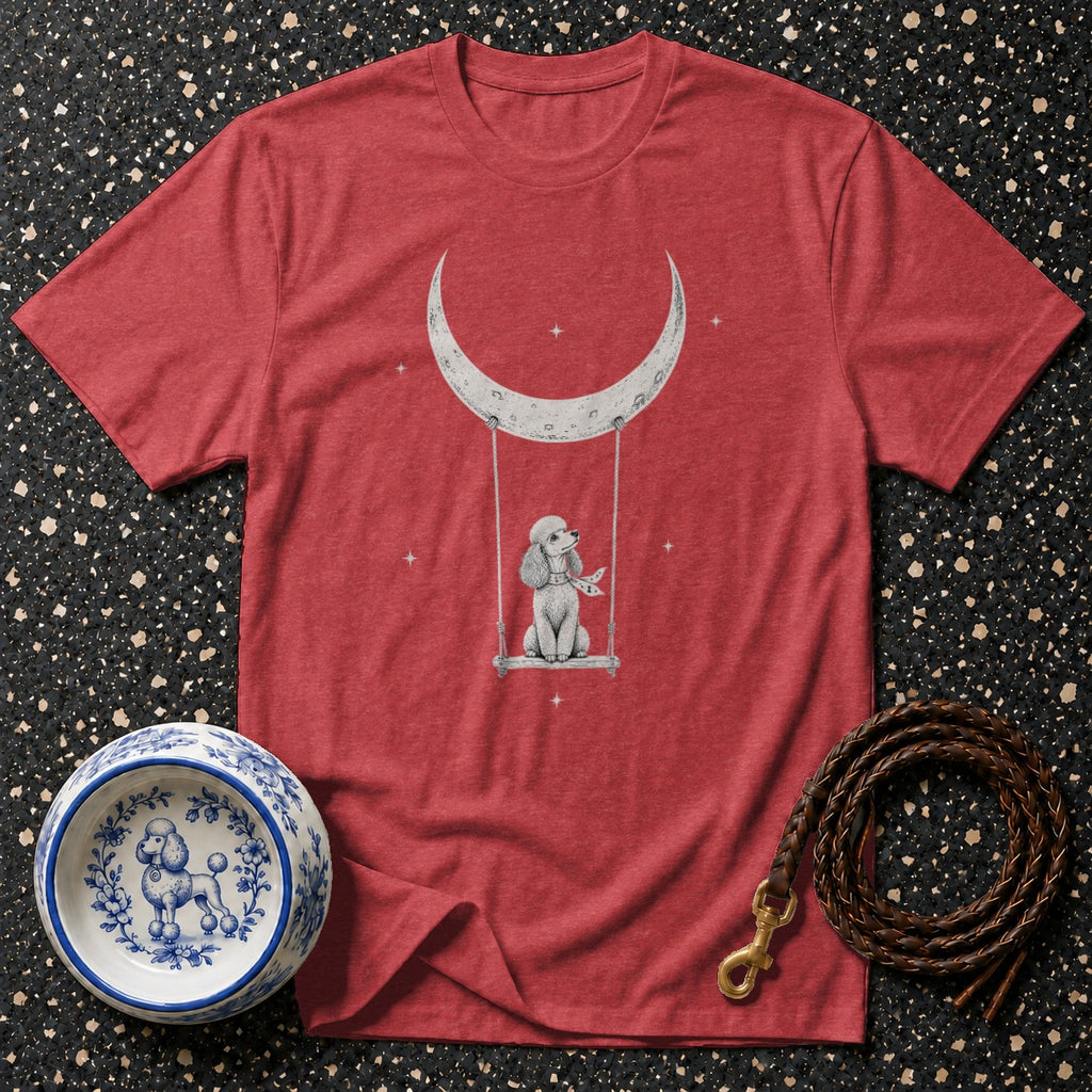 Red t-shirt with illustration of a poodle on a swing under a crescent moon.