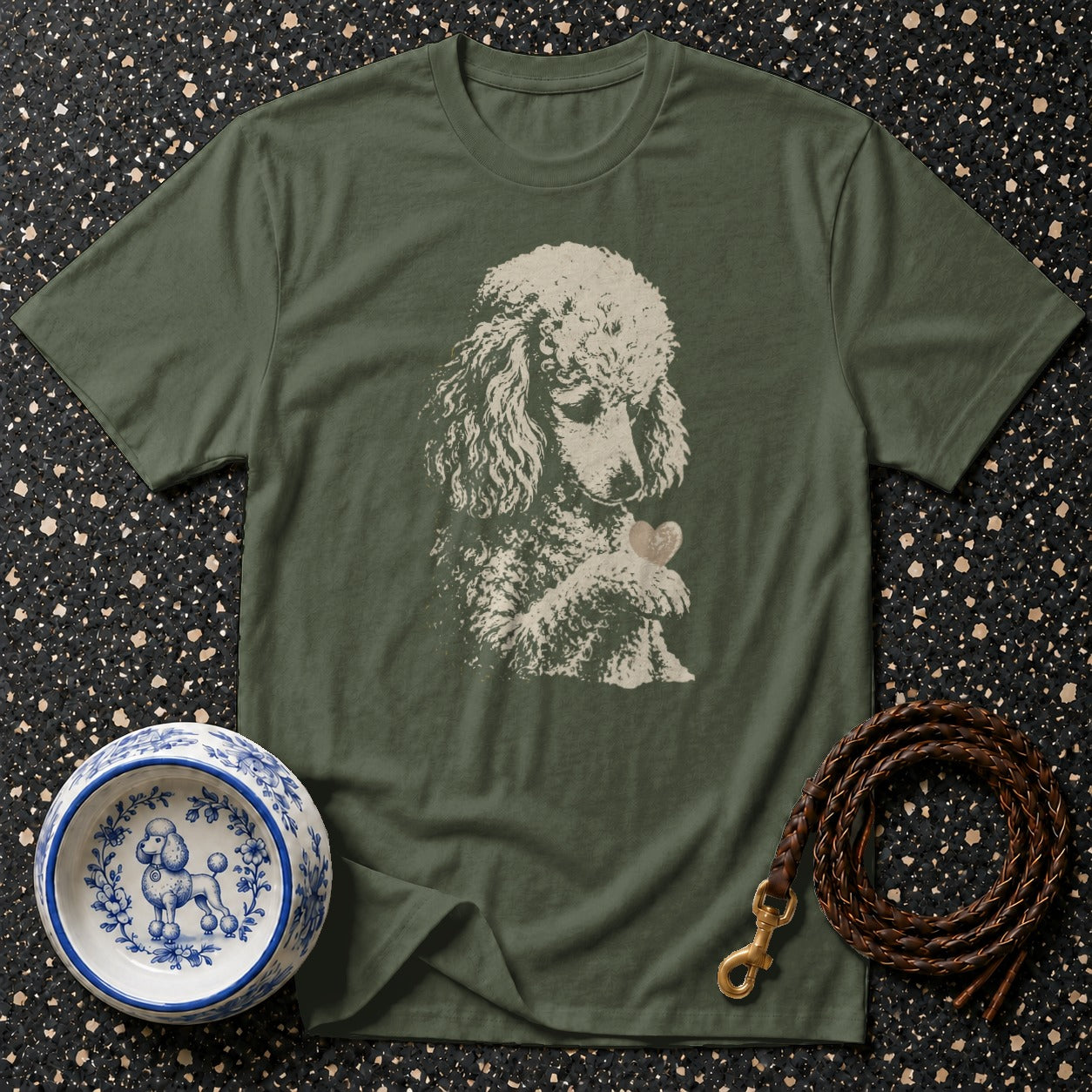 Green t-shirt with a cream poodle illustration holding a heart-shaped object.