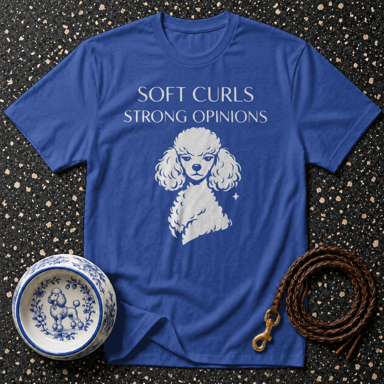 Blue t-shirt with white poodle graphic and "SOFT CURLS STRONG OPINIONS" text.