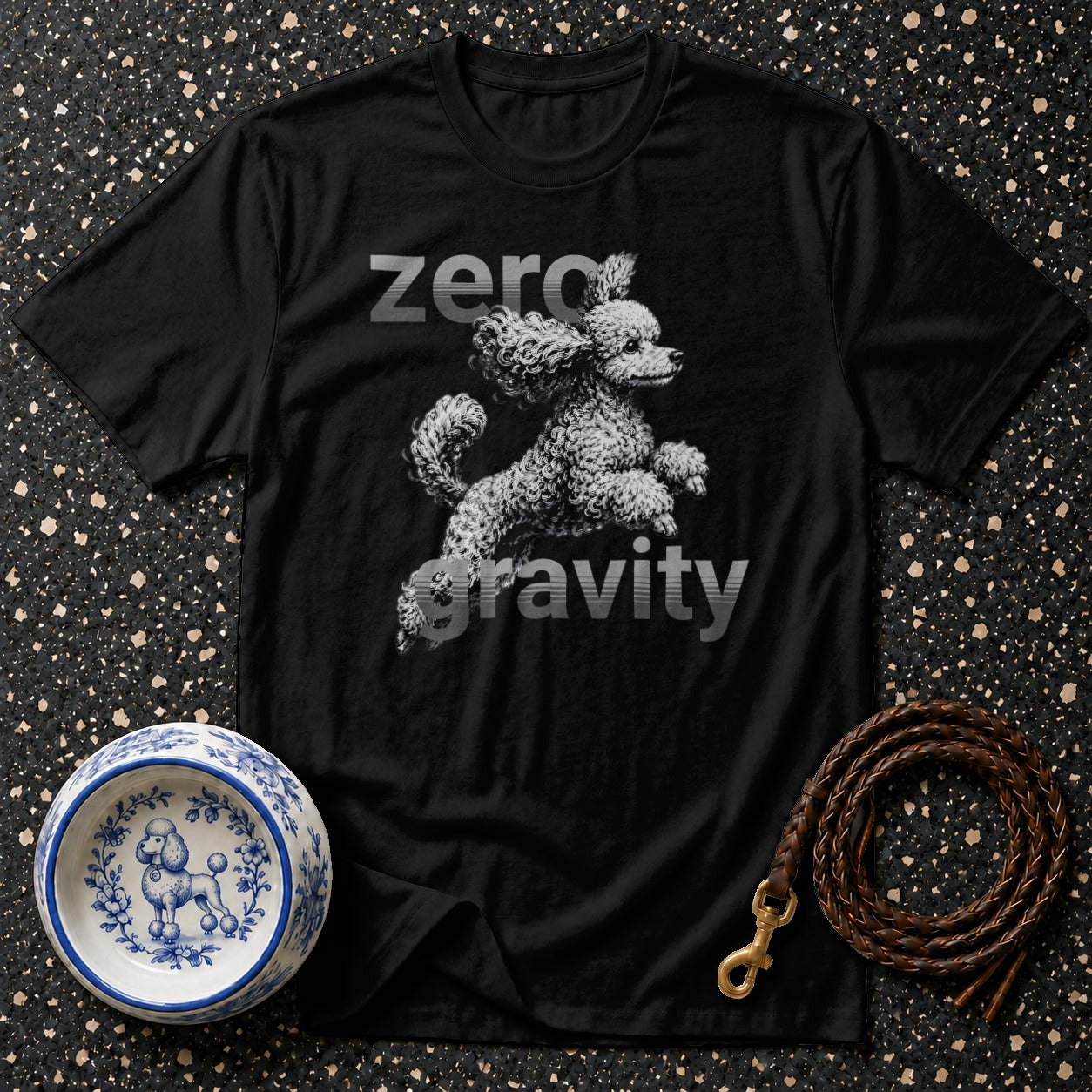 Black t-shirt with "zero gravity" text and a jumping poodle graphic.