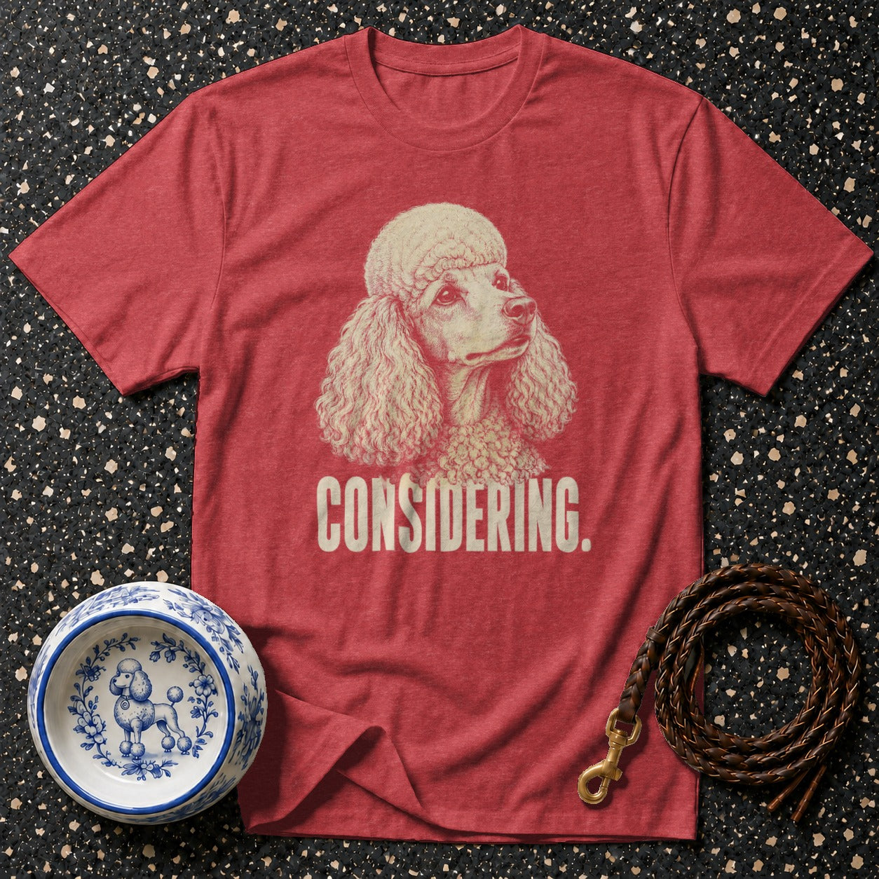 Red t-shirt with poodle graphic and "CONSIDERING." text.