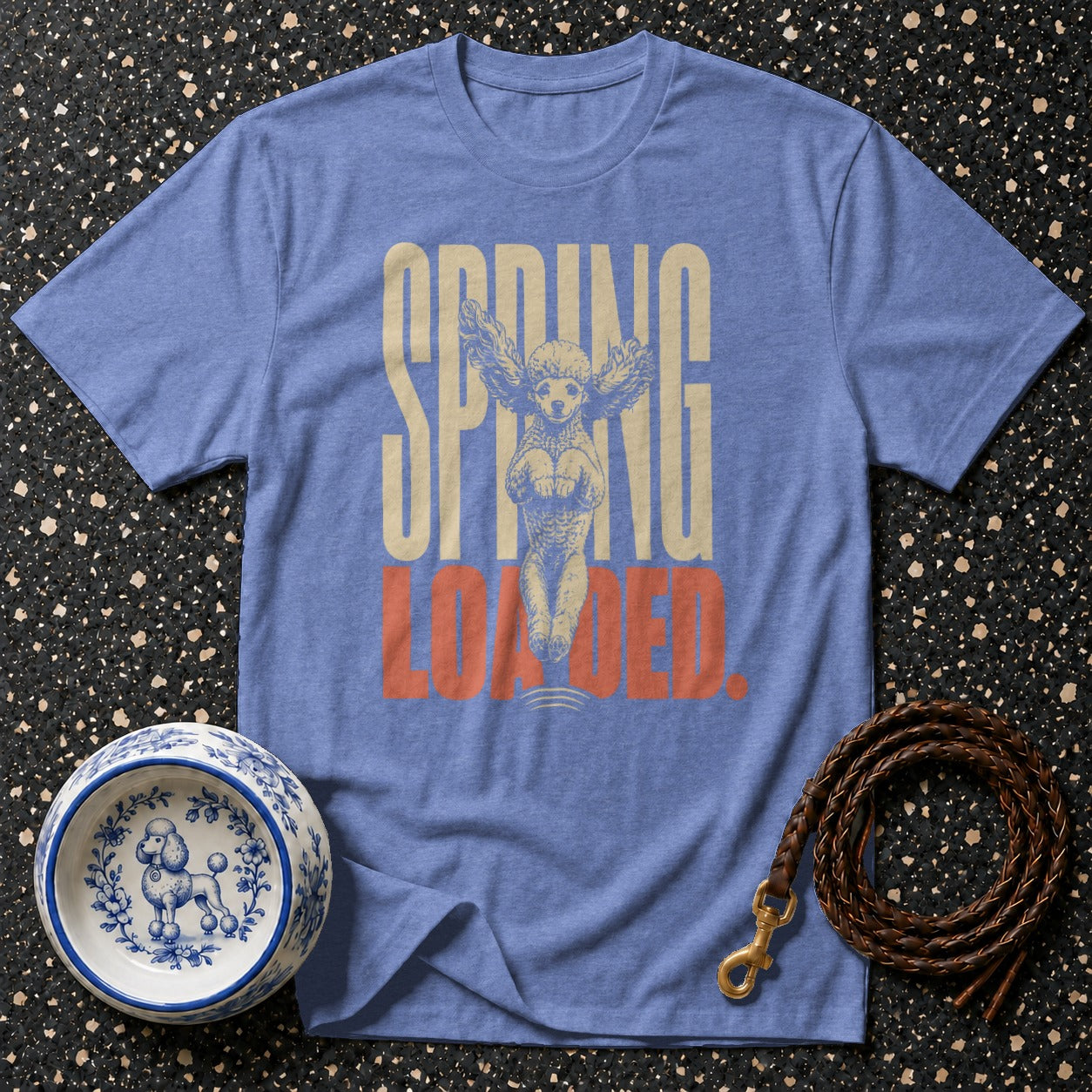 Blue t-shirt with "SPRING LOADED" text and a poodle graphic.