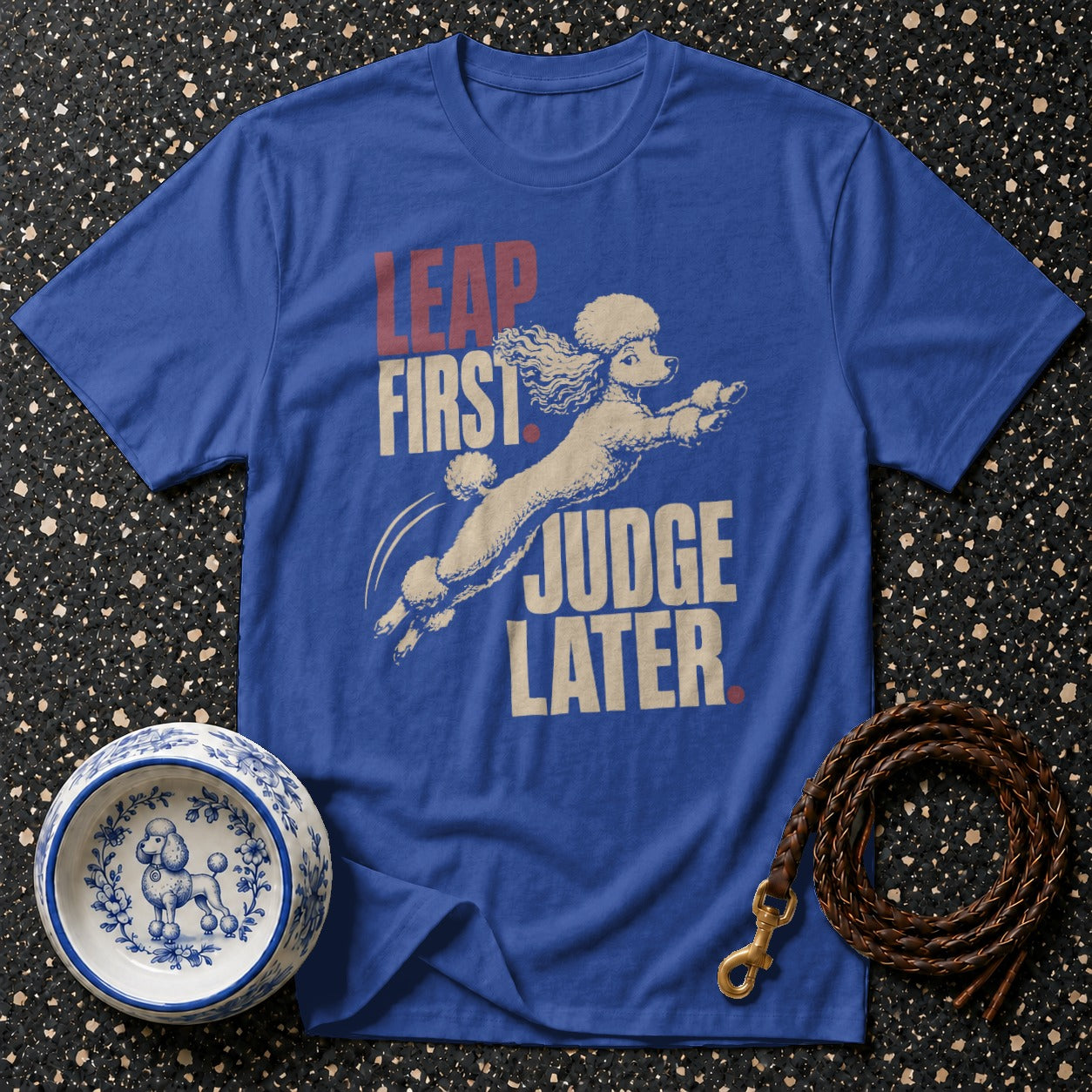 Blue t-shirt with leaping poodle graphic and text "LEAP FIRST JUDGE LATER".