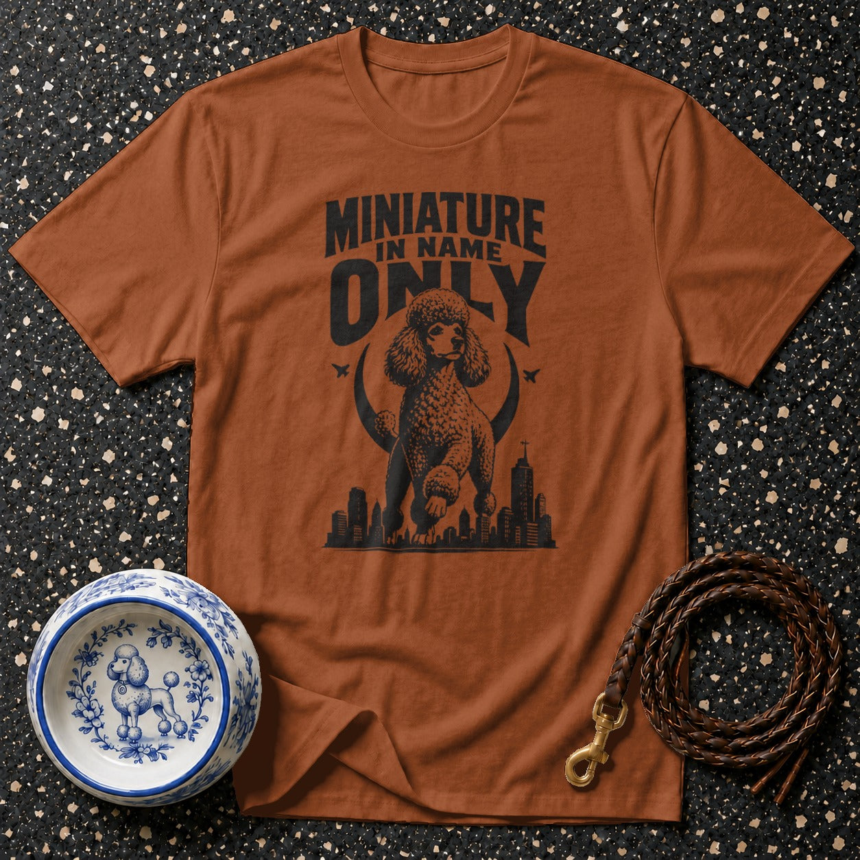 Brown t-shirt with "Miniature In Name Only" and poodle graphic.