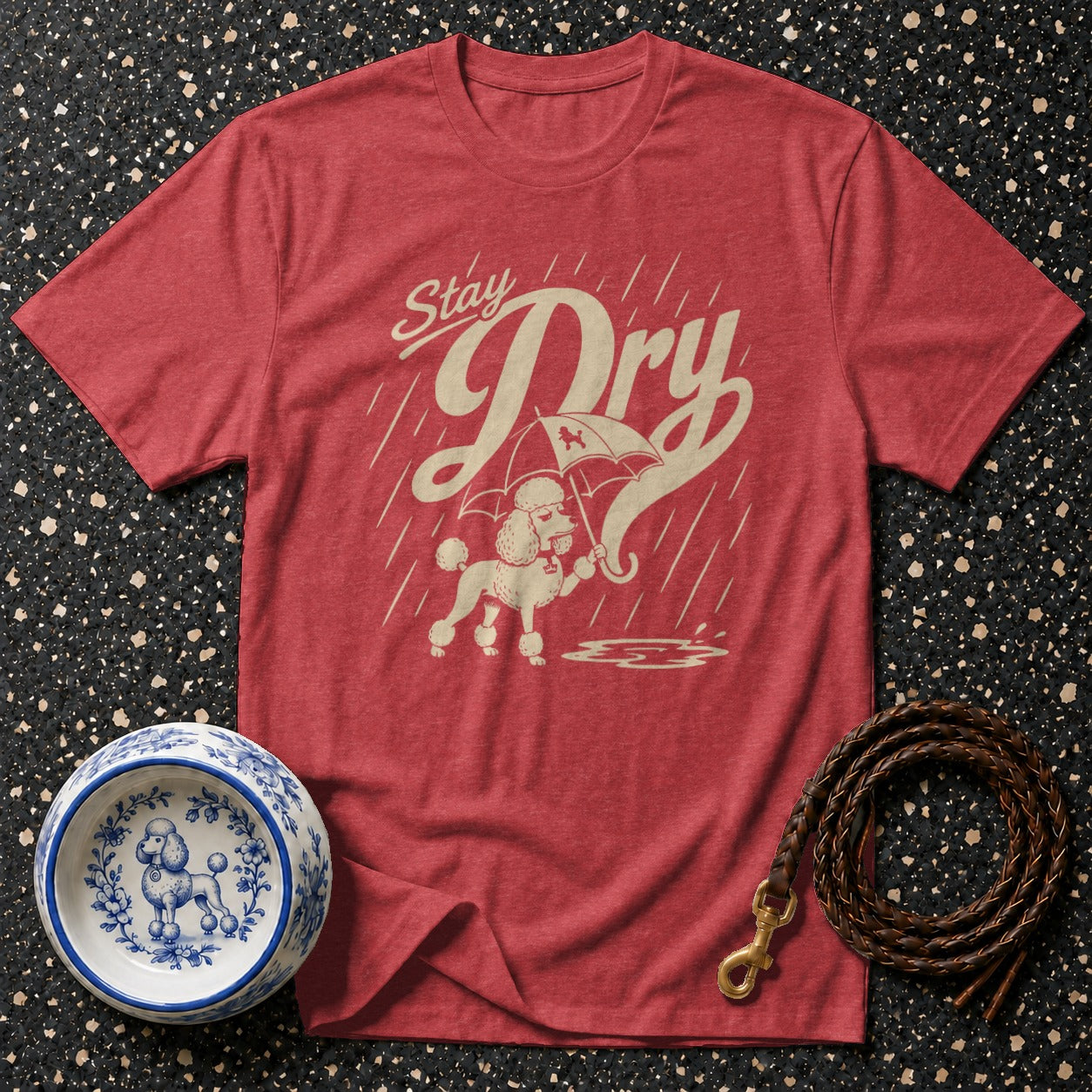 Red t-shirt with poodle under umbrella graphic and "Stay Dry" text.