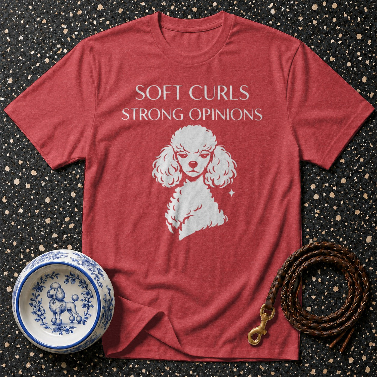 Red t-shirt with white poodle graphic and text "SOFT CURLS STRONG OPINIONS".