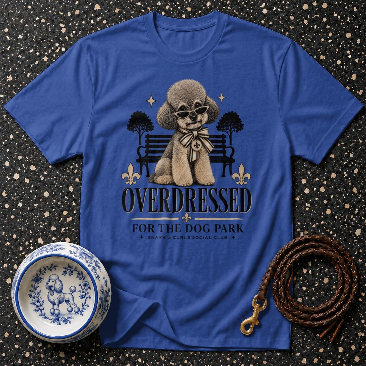 Blue t-shirt with a poodle wearing sunglasses and a bow tie, text reads "OVERDRESSED FOR THE DOG PARK".