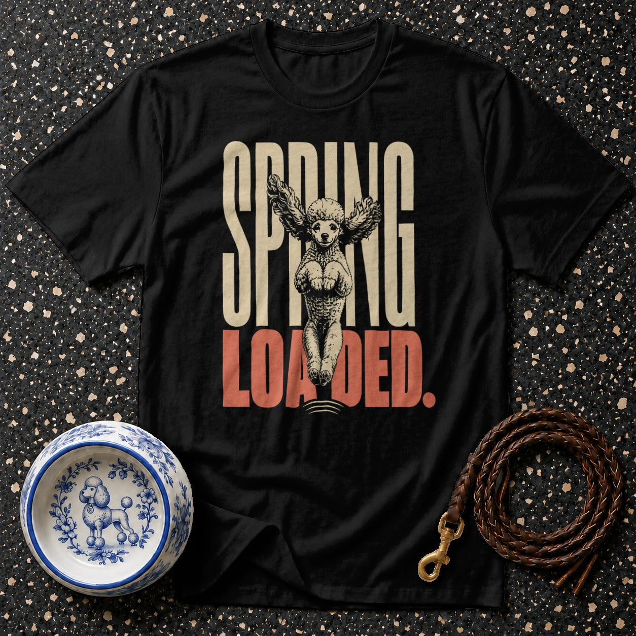 Black t-shirt with "SPRING LOADED" text and a poodle with wings.