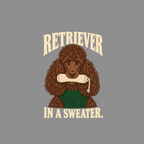 Brown poodle wearing a green sweater holding a rolled-up object in its mouth.