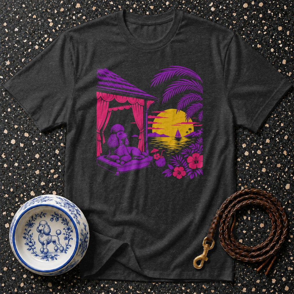 Dark t-shirt with a poodle lounging by a tropical sunset scene.
