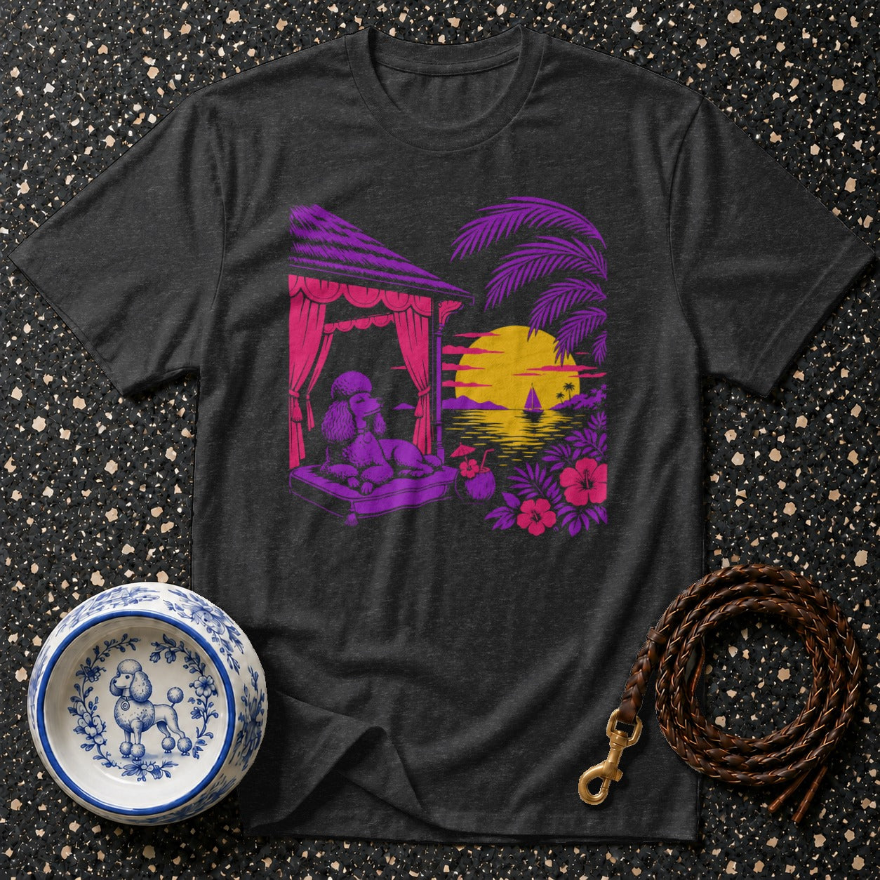 Dark t-shirt with a poodle lounging by a tropical sunset scene.