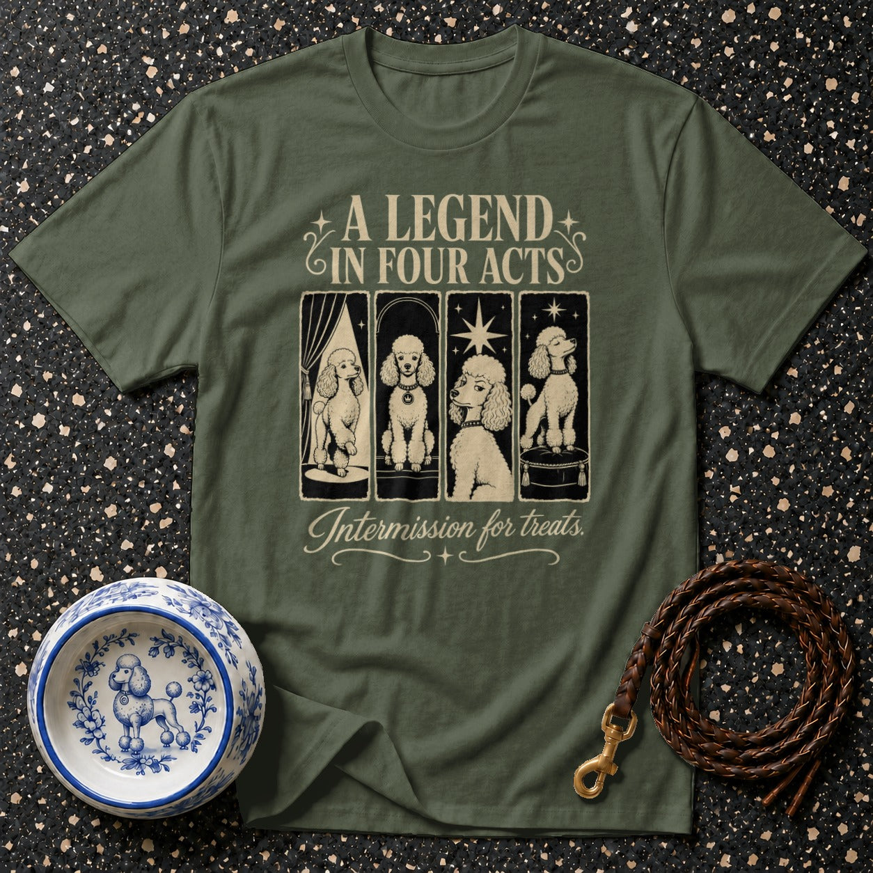 Green t-shirt with a graphic of four poodles and text "A LEGEND IN FOUR ACTS Intermission for treats."