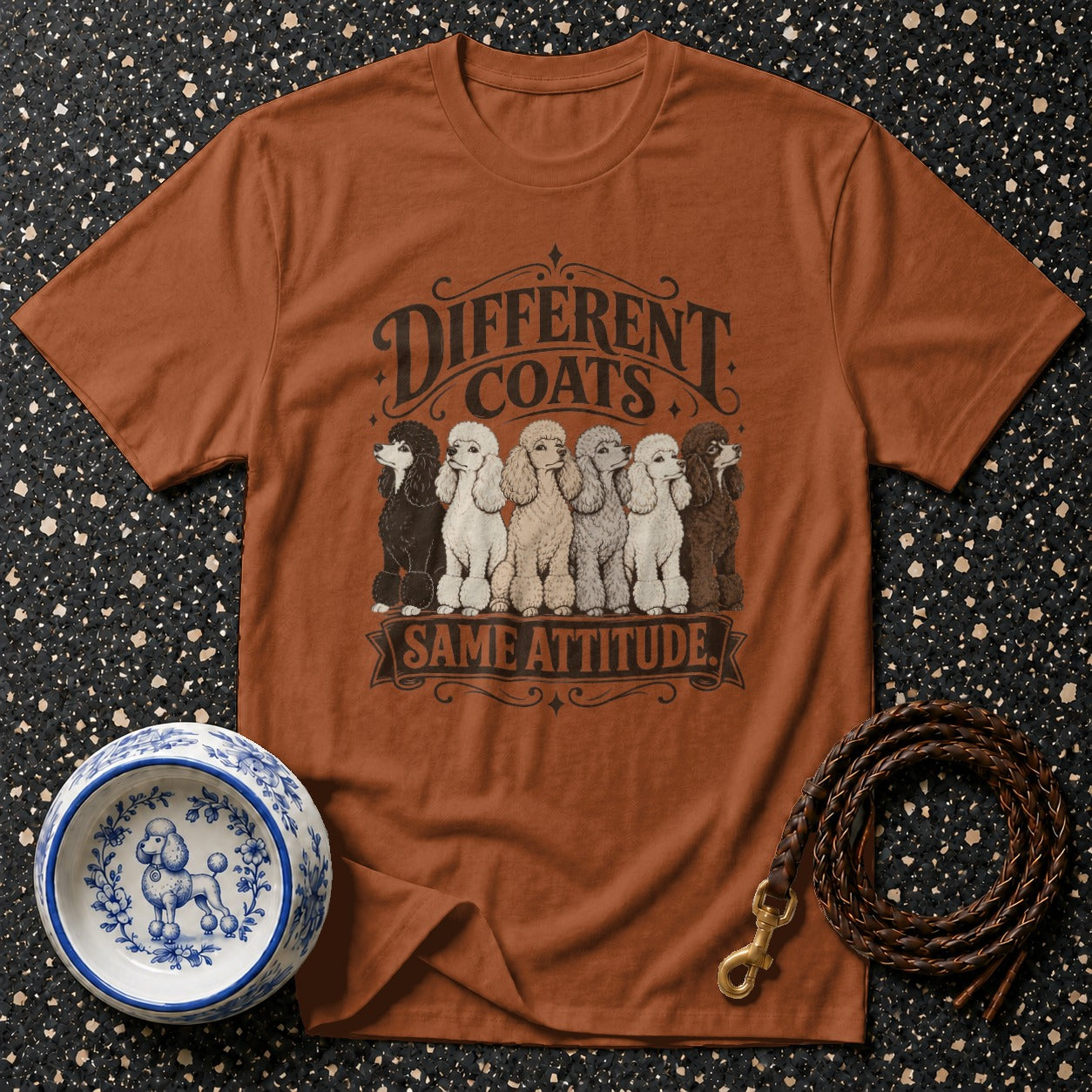T-shirt with "Different Coats Same Attitude" text and six poodles in various colors.