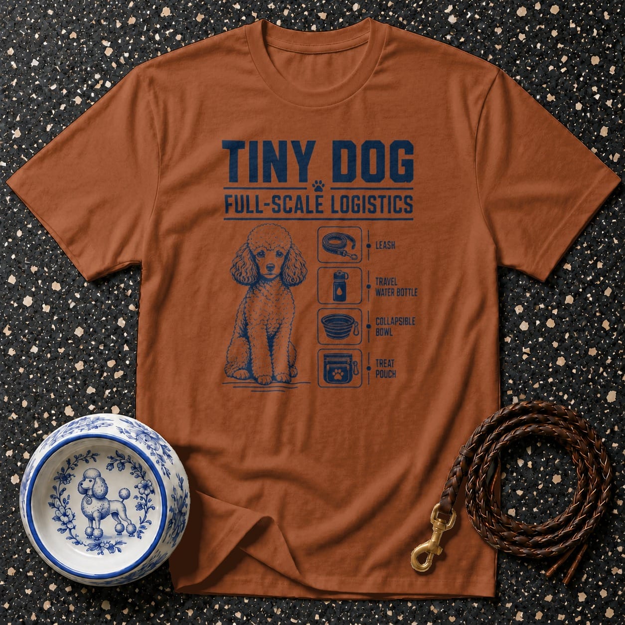 Brown t-shirt with "Tiny Dog Full-Scale Logistics" text and poodle essentials illustration.