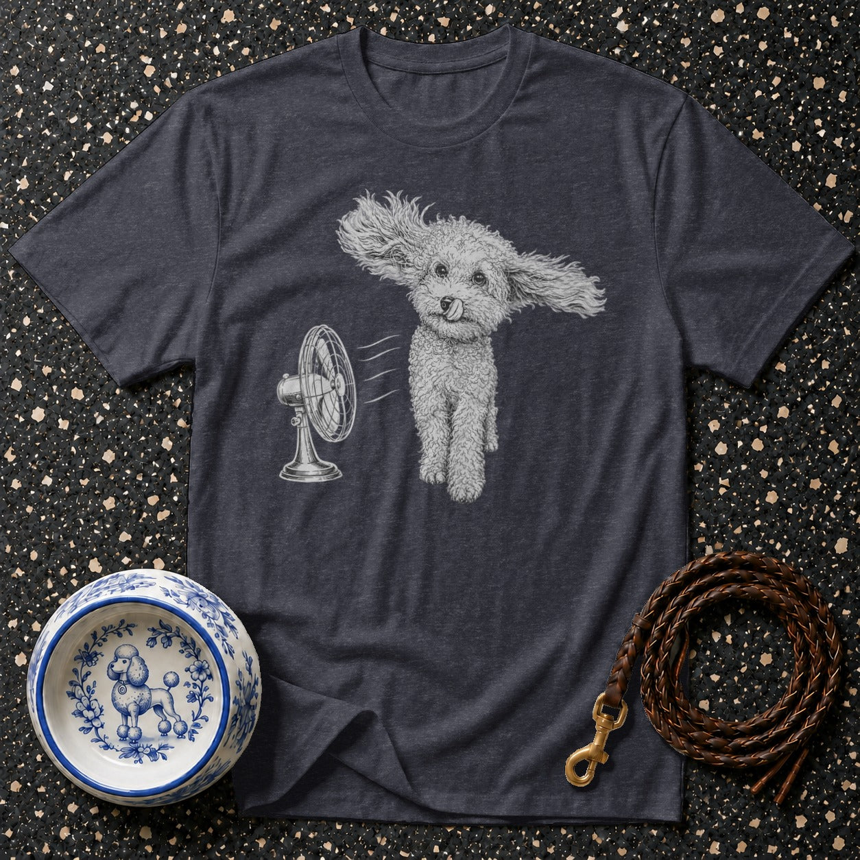 T-shirt with a drawing of a fluffy dog with ears blowing in the wind from a fan.