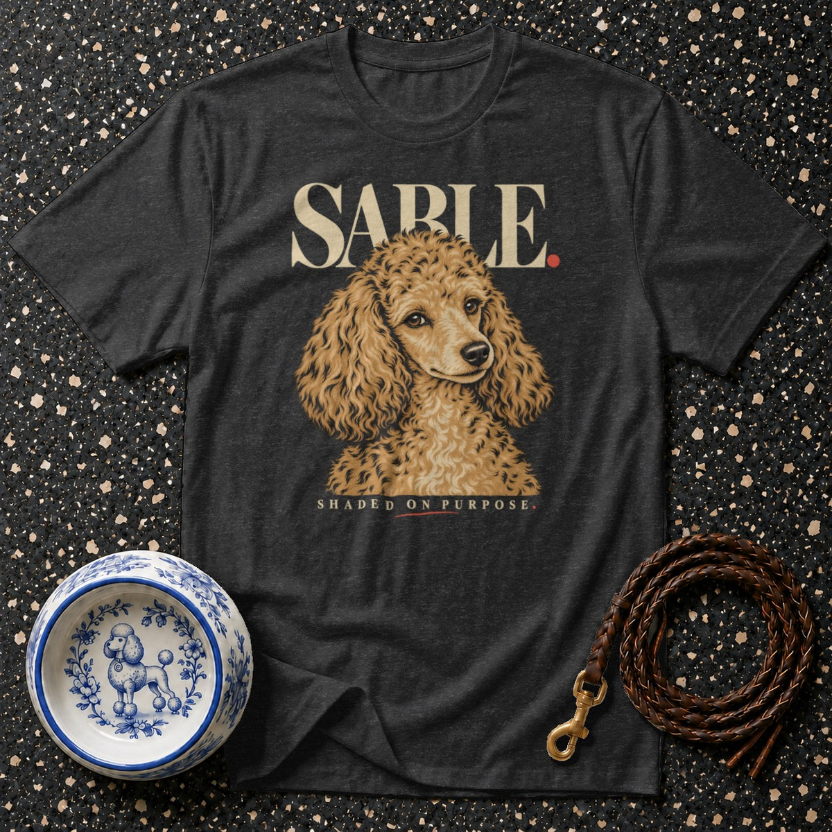 Dark t-shirt with a poodle illustration and text "SABLE SHADED ON PURPOSE."