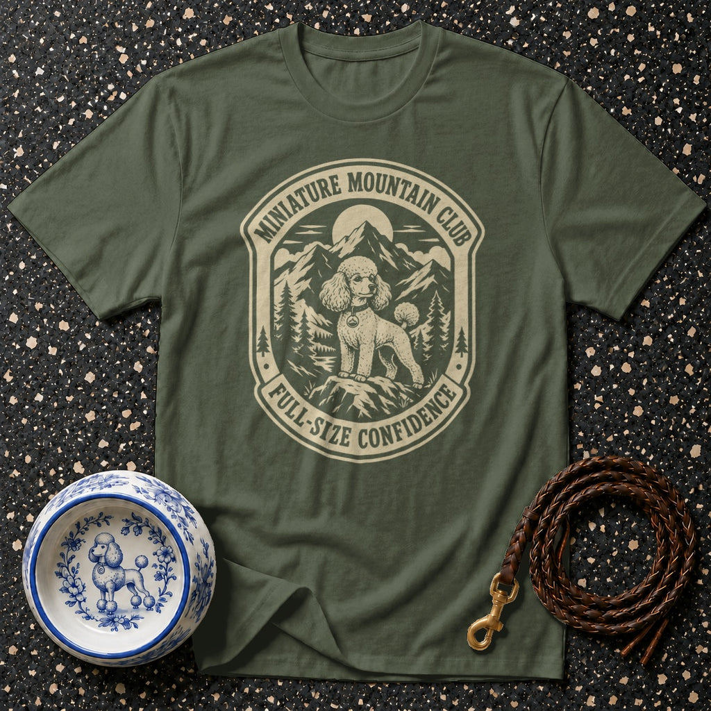 Olive green t-shirt with "Miniature Mountain Club" and a poodle on a mountain crest.