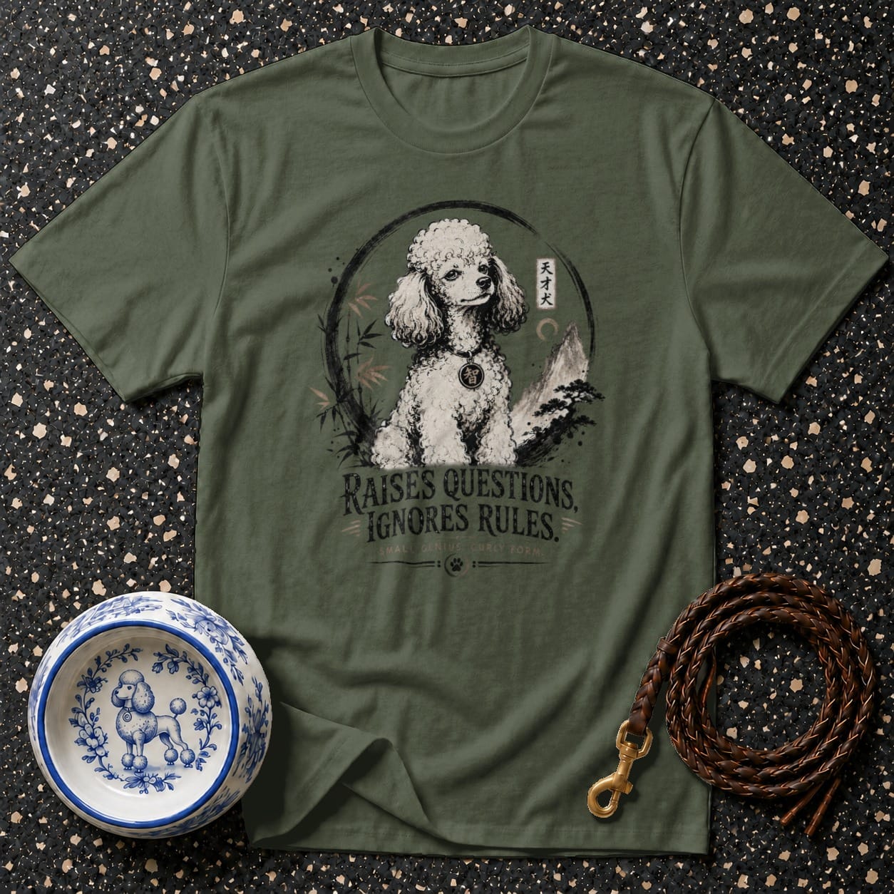Olive green t-shirt with a poodle graphic and text "RAISES QUESTIONS, IGNORES RULES".