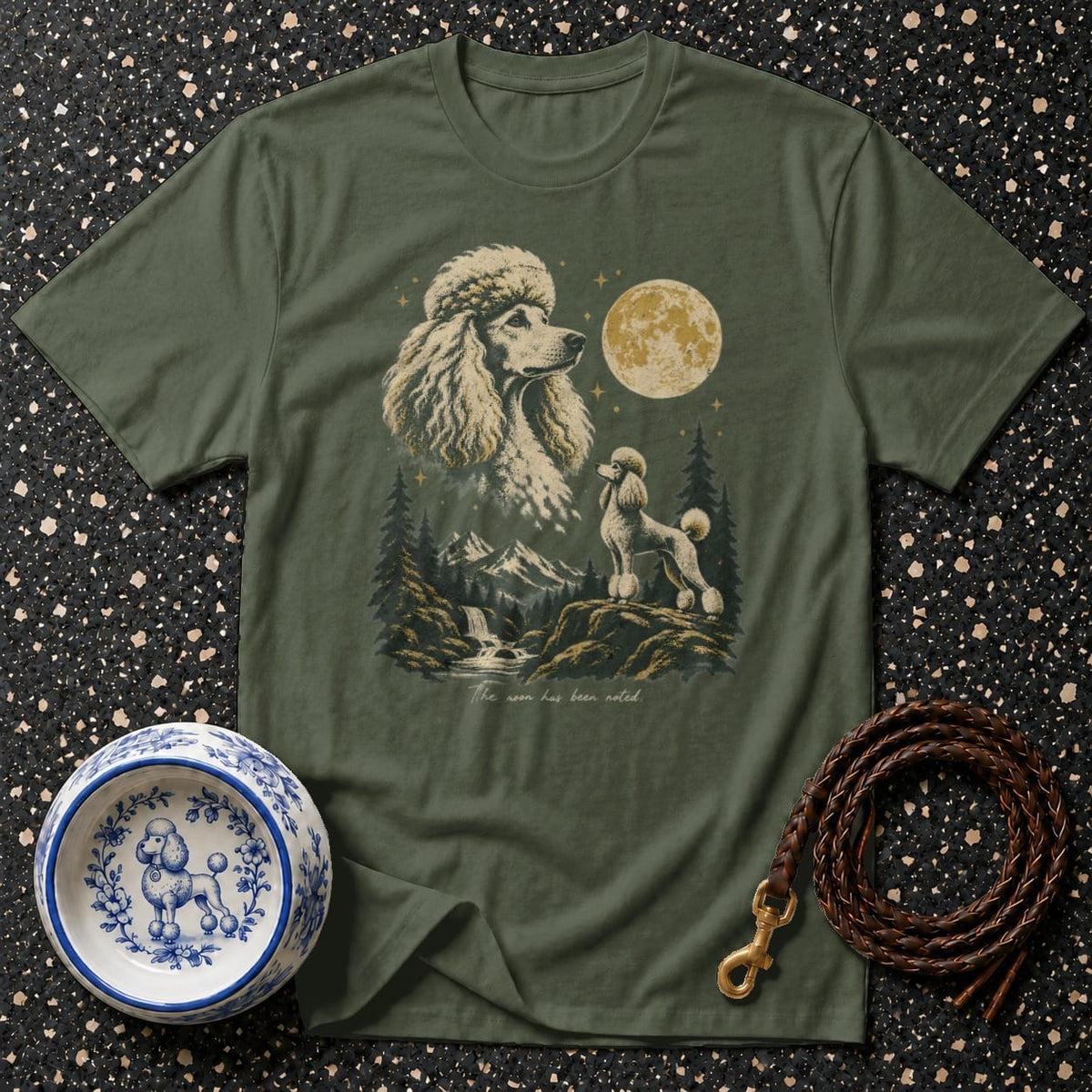 Green t-shirt with poodle graphic and text, "The moon has been noted."