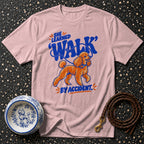 Pink t-shirt with poodle graphic and text "She Learned to Walk By Accident."