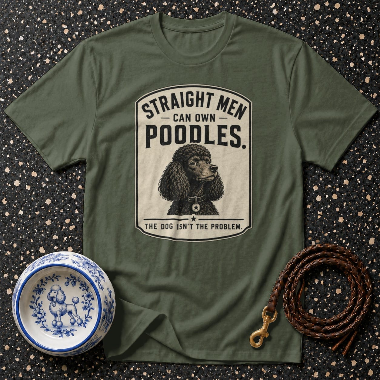 Olive green t-shirt with a poodle graphic and text about men owning poodles.
