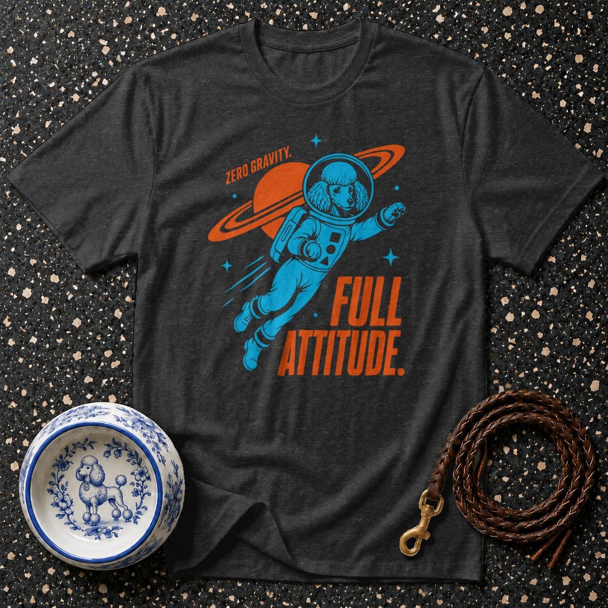 Dark t-shirt with poodle astronaut graphic and "Full Attitude" text.