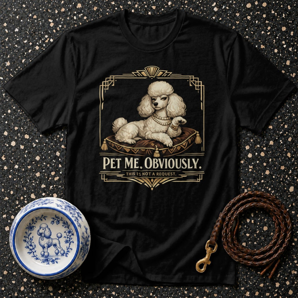 Black t-shirt with a white poodle on a cushion, reading "PET ME. OBVIOUSLY."