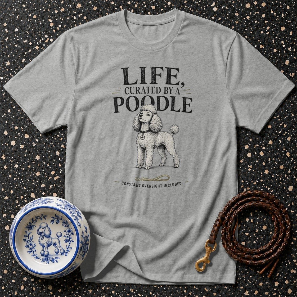 Gray t-shirt with text "LIFE, CURATED BY A POODLE" and a poodle illustration.